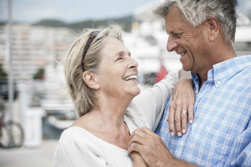 spain, senior couple at harbour