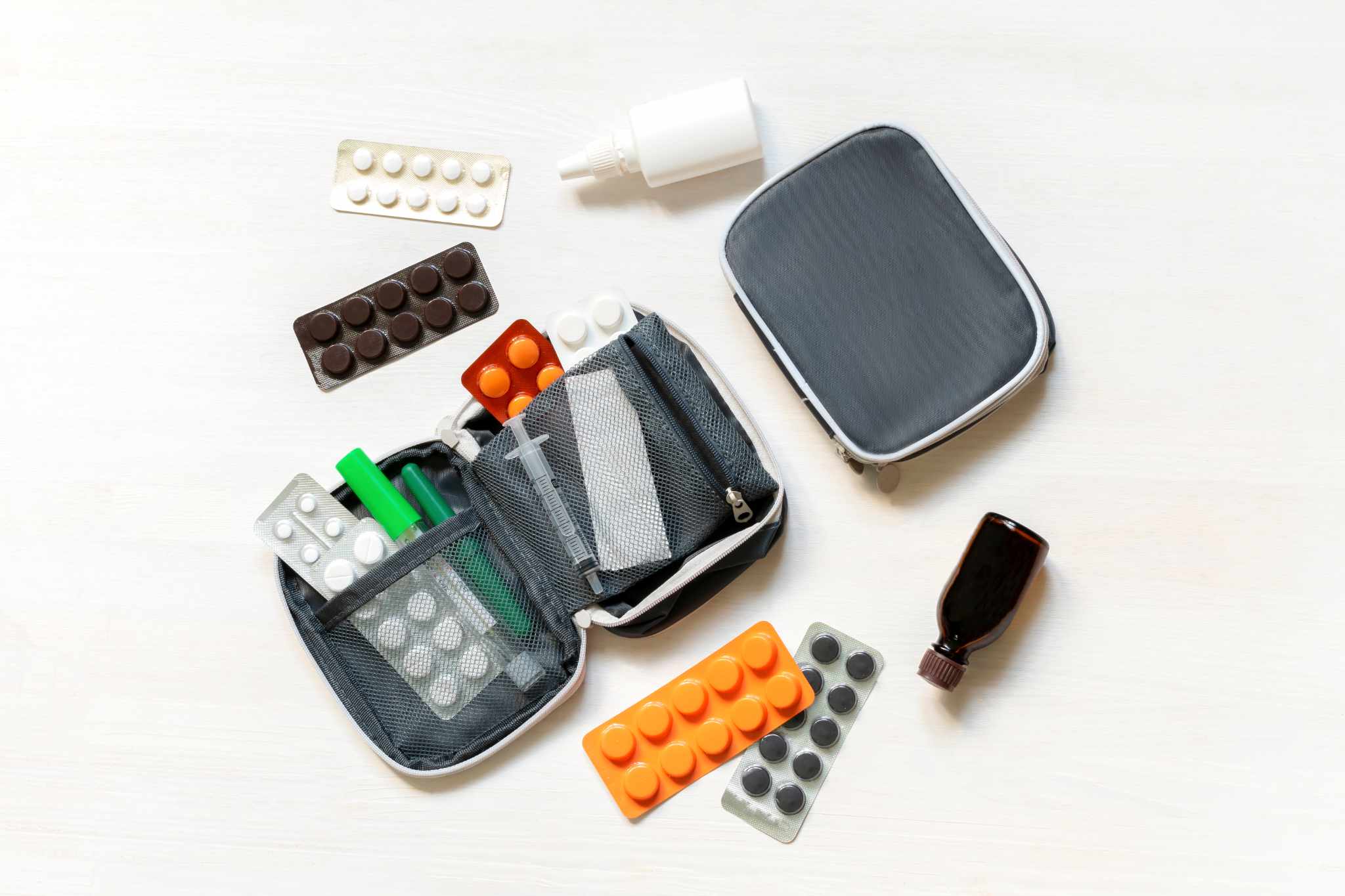 daily medicine chest, container of pills, tablets, vitamins, travel first aid kit. pill box dispenser medications, nutritional supplements. medical treatment for disease virus dosage of medicine