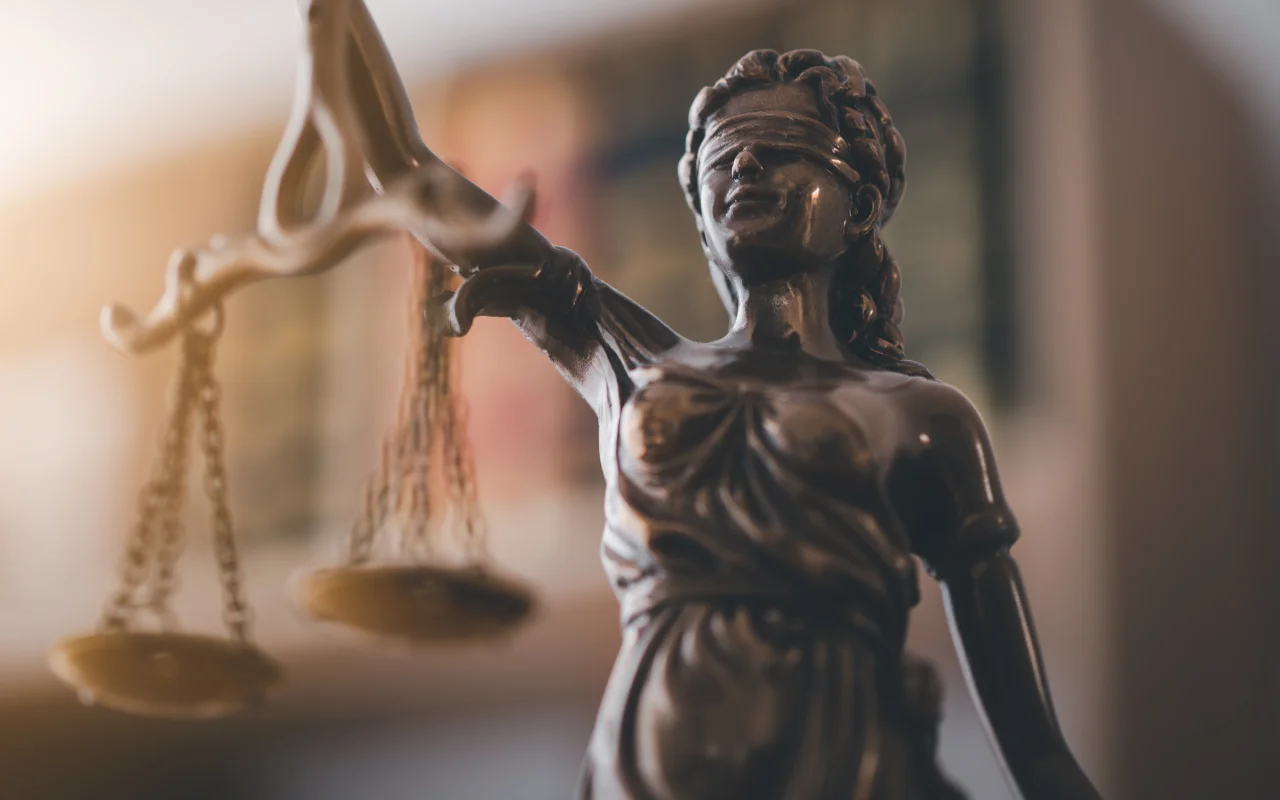 Close-up of a statue of Justice holding scales