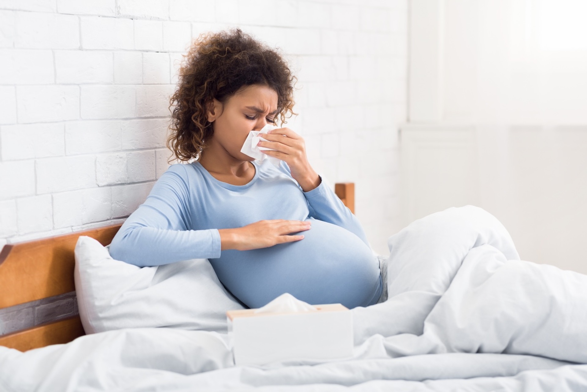 pregnant woman with a cold lying in bed 2026 03 24 02 24 22 utc 2