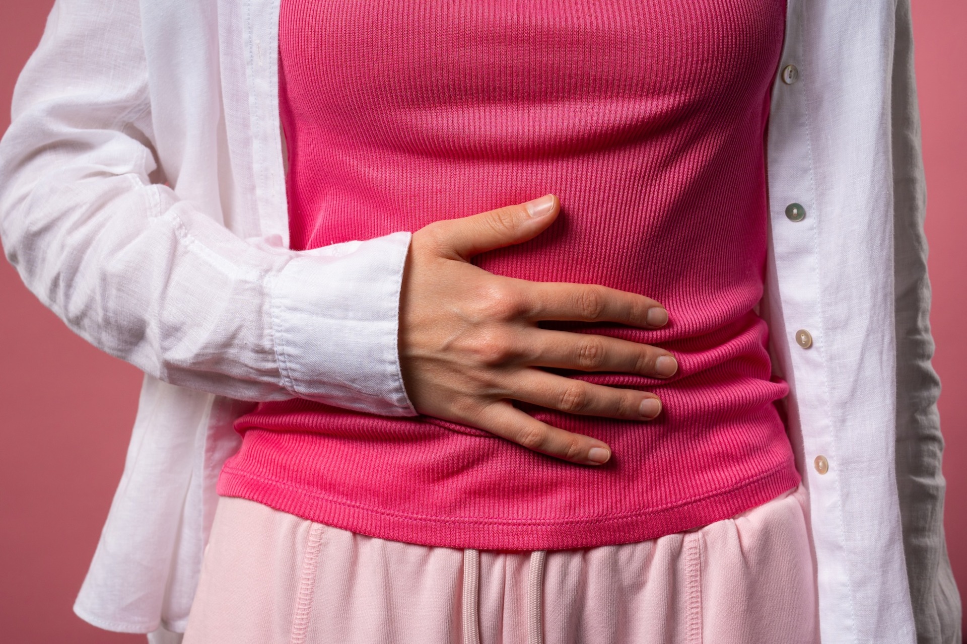 Woman holding her stomach due to painful cramps March 24, 2026, 05:32:08 UTC