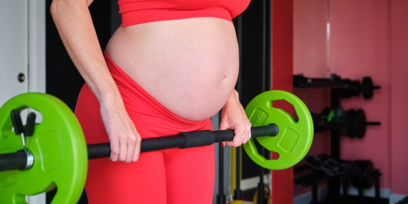 pregnant adult lifting barbell in home gym 2026 03 24 04 13 49 utc 2