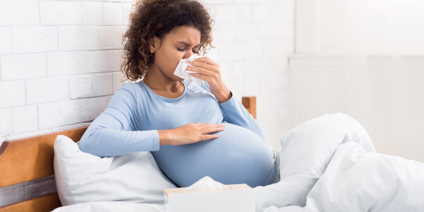pregnant woman with a cold lying in bed 2026 03 24 02 24 22 utc 2